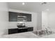 Kitchen with dark cabinets, marble countertops, and stainless steel appliances at 5484 E Rock Bush Ln, San Tan Valley, AZ 85140