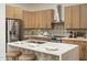 Beautiful kitchen featuring modern cabinetry, stainless steel appliances and quartz countertops at 6137 E Roland St, Mesa, AZ 85215