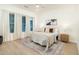 Bright and spacious main bedroom featuring soft carpeting, neutral colors, and a cozy rug at 6137 E Roland St, Mesa, AZ 85215