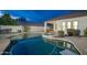 Sparkling swimming pool with attached spa in private backyard oasis at 6137 E Roland St, Mesa, AZ 85215