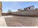 Spacious backyard with gravel and a block wall at 6208 S Eagle Pass Rd, Gold Canyon, AZ 85118