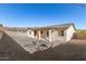 Home with gravel backyard and covered patio at 6208 S Eagle Pass Rd, Gold Canyon, AZ 85118