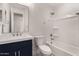 Bathroom boasts a navy vanity, white tub, and mirror at 6208 S Eagle Pass Rd, Gold Canyon, AZ 85118