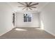 Spacious bedroom with carpeted floor and ceiling fan at 6208 S Eagle Pass Rd, Gold Canyon, AZ 85118