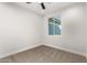 Well-lit bedroom with carpet flooring and window at 6208 S Eagle Pass Rd, Gold Canyon, AZ 85118