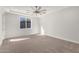 Bright bedroom with carpeted floor and ceiling fan at 6208 S Eagle Pass Rd, Gold Canyon, AZ 85118