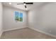 Bright bedroom with neutral wall and carpet at 6208 S Eagle Pass Rd, Gold Canyon, AZ 85118