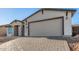 New home with light-colored brick and a two-car garage at 6208 S Eagle Pass Rd, Gold Canyon, AZ 85118