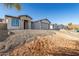 Brand new home on a hill with a two-car garage and paver driveway at 6208 S Eagle Pass Rd, Gold Canyon, AZ 85118