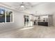 Open kitchen with white cabinets, a large island, and stainless steel appliances at 6208 S Eagle Pass Rd, Gold Canyon, AZ 85118