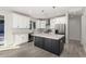 Modern kitchen with white cabinets, stainless steel appliances, and large island at 6208 S Eagle Pass Rd, Gold Canyon, AZ 85118