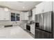 Modern kitchen with white cabinets, stainless steel appliances and large island at 6208 S Eagle Pass Rd, Gold Canyon, AZ 85118