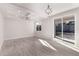 Bright and airy living room with tile floors and sliding glass doors at 6208 S Eagle Pass Rd, Gold Canyon, AZ 85118