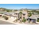 Two-story house with a three-car garage and a palm tree in the front yard at 6618 W Red Fox Rd, Phoenix, AZ 85083