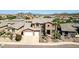 Two-story house with a three-car garage, and a palm tree in the front yard at 6618 W Red Fox Rd, Phoenix, AZ 85083