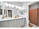 Elegant bathroom with double vanity and marble countertop at 6618 W Red Fox Rd, Phoenix, AZ 85083