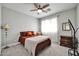 Bright bedroom featuring a double bed and ceiling fan at 6618 W Red Fox Rd, Phoenix, AZ 85083