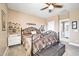 Charming bedroom with an ornate bed frame and bookshelves at 6618 W Red Fox Rd, Phoenix, AZ 85083