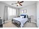 Serene bedroom with a metal bed frame and window at 6618 W Red Fox Rd, Phoenix, AZ 85083