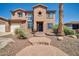 Two-story house with a three-car garage and a curved walkway leading to the entrance at 6618 W Red Fox Rd, Phoenix, AZ 85083