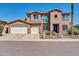 Two-story house with a three-car garage and a walkway leading to the entrance at 6618 W Red Fox Rd, Phoenix, AZ 85083