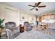 Cozy Gathering room with two armchairs and a kitchenette at 6618 W Red Fox Rd, Phoenix, AZ 85083