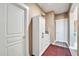 Bright hallway with linen closet and red patterned rug at 6618 W Red Fox Rd, Phoenix, AZ 85083