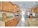 Modern kitchen featuring granite countertops and ample cabinetry at 6618 W Red Fox Rd, Phoenix, AZ 85083