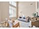 Light-filled living room with comfy seating and a piano at 6618 W Red Fox Rd, Phoenix, AZ 85083