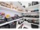 Well-organized pantry with ample shelving for storage at 6618 W Red Fox Rd, Phoenix, AZ 85083