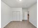 Simple bedroom with tile floors and mirrored closet at 6638 S 6Th Ave, Phoenix, AZ 85041