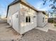 Rear view of house showcasing a side yard and exterior details at 6638 S 6Th Ave, Phoenix, AZ 85041