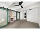 Bright bedroom with mirrored closet doors and ceiling fan at 6840 E 2Nd St # 14, Scottsdale, AZ 85251