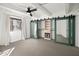 Bedroom with ceiling fan and mirrored closet doors at 6840 E 2Nd St # 14, Scottsdale, AZ 85251