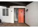 Front entrance with red door and stone pathway at 6840 E 2Nd St # 14, Scottsdale, AZ 85251