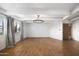 Living room with terracotta floors and wood entry door at 6840 E 2Nd St # 14, Scottsdale, AZ 85251