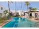 Refreshing community pool with surrounding patio furniture at 6840 E 2Nd St # 14, Scottsdale, AZ 85251