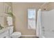 Simple bathroom with shower/tub combo and window at 710 S Monterey St, Gilbert, AZ 85233