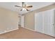 Bright bedroom with ceiling fan and double closet at 710 S Monterey St, Gilbert, AZ 85233