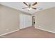 Cozy bedroom with ceiling fan and double closet at 710 S Monterey St, Gilbert, AZ 85233