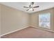 Charming bedroom with ceiling fan and window at 710 S Monterey St, Gilbert, AZ 85233