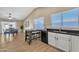 Bright dining area with wood flooring and adjacent kitchen at 710 S Monterey St, Gilbert, AZ 85233