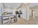 Eat-in kitchen with breakfast bar and wood-look flooring at 710 S Monterey St, Gilbert, AZ 85233