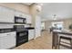 Kitchen boasts black appliances and an eat-in kitchen island at 710 S Monterey St, Gilbert, AZ 85233