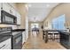 Open kitchen features a breakfast bar and view into dining area at 710 S Monterey St, Gilbert, AZ 85233