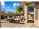 Spacious backyard patio with seating and built-in grill at 7105 E Hibiscus Way, Scottsdale, AZ 85266