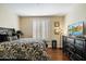 Main bedroom with a large dresser and a comfortable bed at 7105 E Hibiscus Way, Scottsdale, AZ 85266