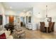 Elegant dining room with wood table, neutral decor, and a piano at 7105 E Hibiscus Way, Scottsdale, AZ 85266