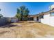 Home's backyard with covered patio and large yard at 7213 W Osborn Rd, Phoenix, AZ 85033