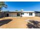 Home's backyard with covered patio and large yard at 7213 W Osborn Rd, Phoenix, AZ 85033